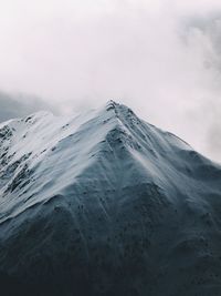 Scenic view of mountains against sky during winter