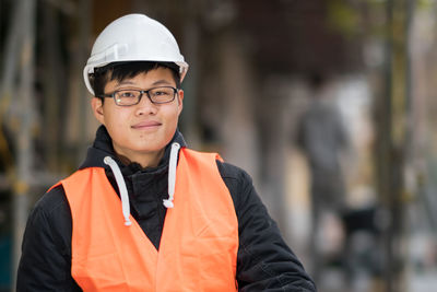 Portrait of engineer in reflective clothing outdoors