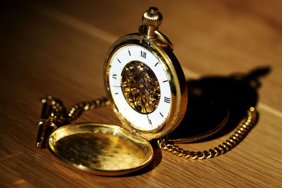 High angle view of clock on table