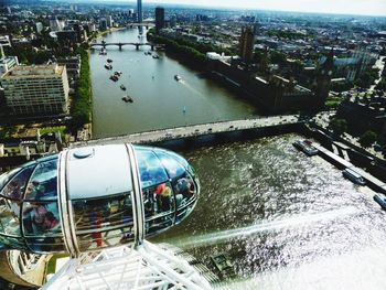 Boats in river with city in background