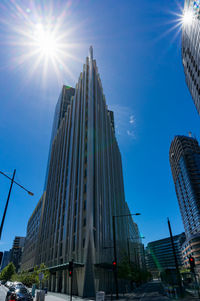 Low angle view of buildings against blue sky