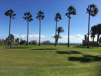 Panoramic view of golf course against sky