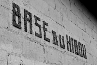 Close-up of text on wall