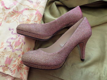 Close-up of pink high heels