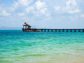 Pier over sea against sky