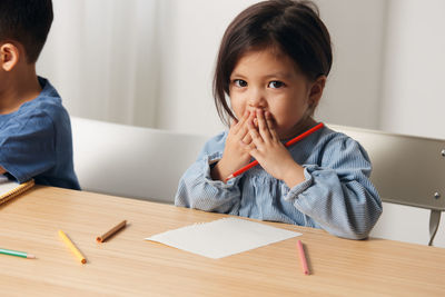 Portrait of girl studying at home