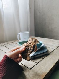 Cropped image of person having food