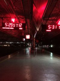 Illuminated railroad station in city at night