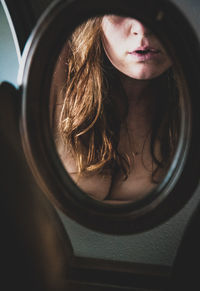 Close-up portrait of woman with reflection