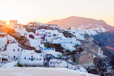 Traditional white cave houses on a cliff on the island santorini, cyclades, greece