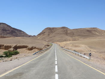 Road on mountain against clear sky