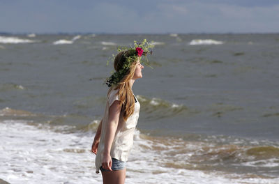 Woman standing on beach