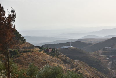 Scenic view of landscape and mountains against sky