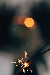 Close-up of illuminated sparkler at night