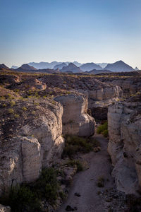 View of rocky mountain against clear sky