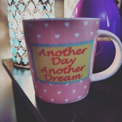 Close-up of coffee cup on table