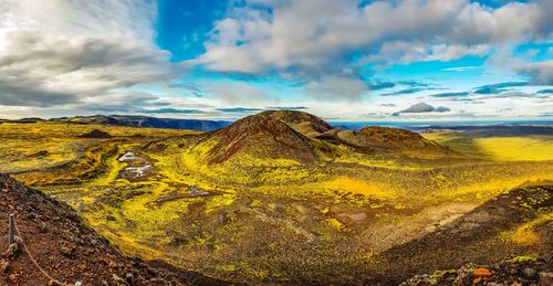 Panoramic view of landscape against cloudy sky