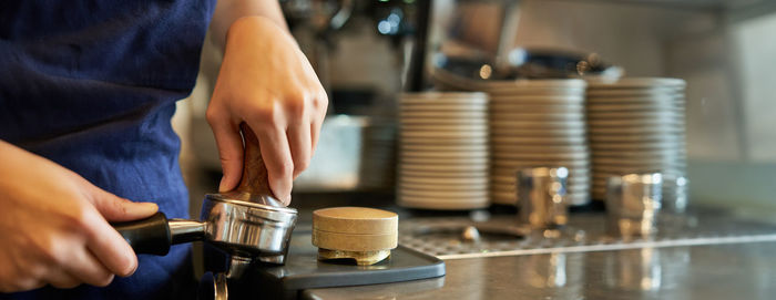 Midsection of man working on table