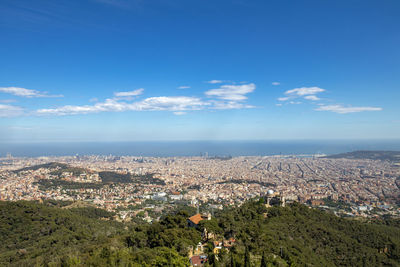 Aerial view of townscape against sky