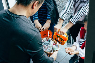 High angle view of father with daughter toy