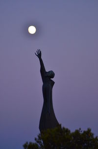 Low angle view of statue against clear sky