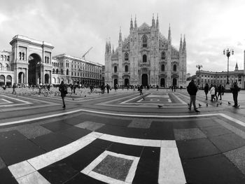 Tourists in front of building