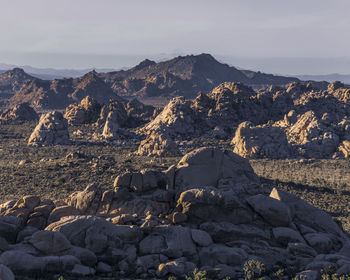 Rock formation on land against sky