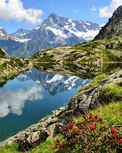 Scenic view of lake and mountains against sky