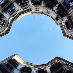 Low angle view of building against blue sky