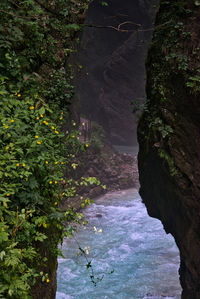 High angle view of waterfall along rocks