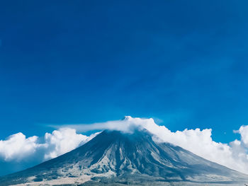 Scenic view of volcanic crater against sky