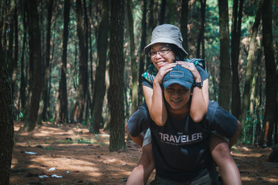 Portrait of smiling man in forest