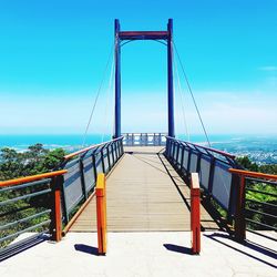 View of suspension bridge against clear sky