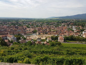 Aerial view of townscape against sky