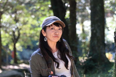 Portrait of young woman in forest