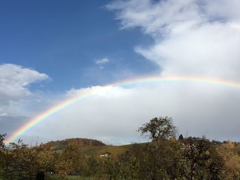 Low angle view of rainbow against sky