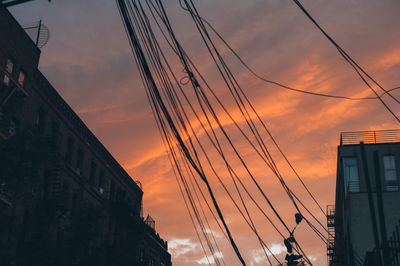 Low angle view of electricity pylon against sky