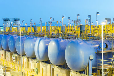 Panoramic shot of factory against clear blue sky