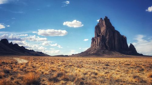 Scenic view of arid landscape against sky