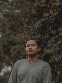 Portrait of young man looking away