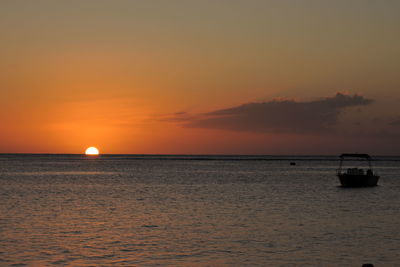 Scenic view of sunset against cloudy sky