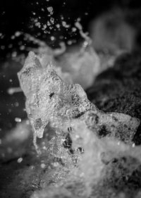 Close-up of water splashing on rocks