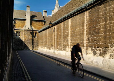 Rear view of man walking on street