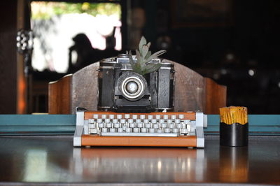 Close-up of camera on table at home