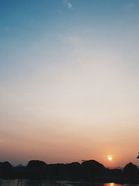 Silhouette mountains against sky during sunset