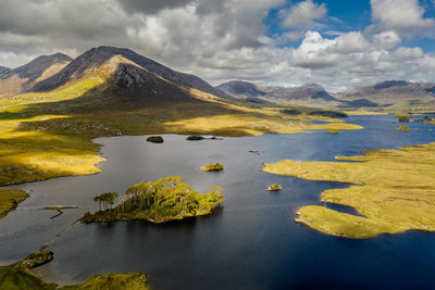 Scenic view of lake and mountains against sky