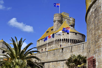 Low angle view of building against blue sky