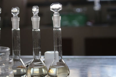 Close-up of glass bottle on table