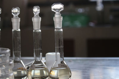 Close-up of glass bottle on table