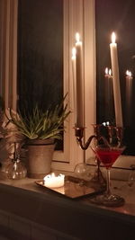 Illuminated lamps on table at home